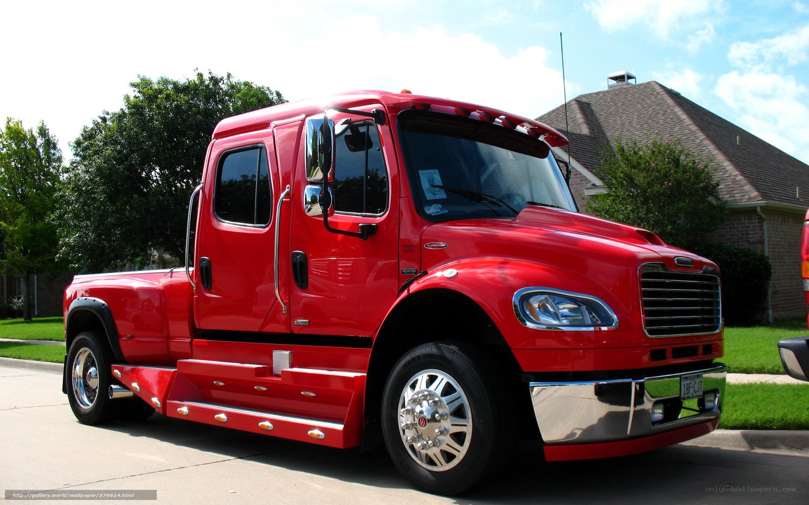 Red Freightliner truck on street