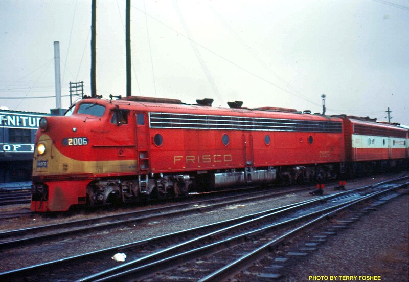 Red Frisco locomotive on tracks