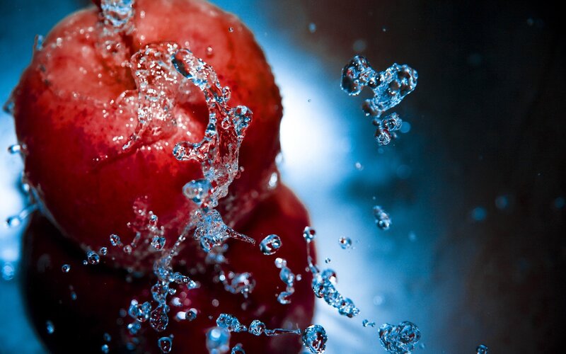 Red Fruit Splashing Water
