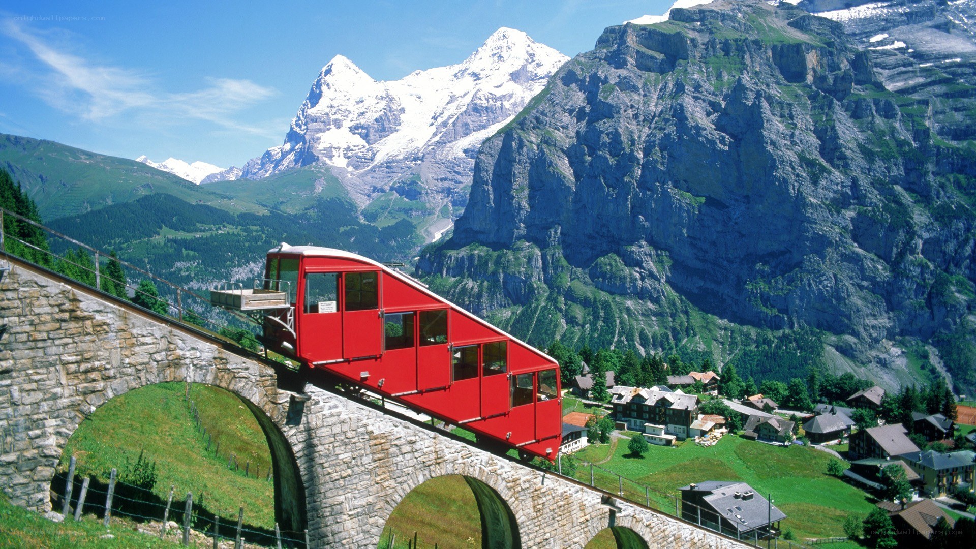 Red funicular train in Swiss Alps