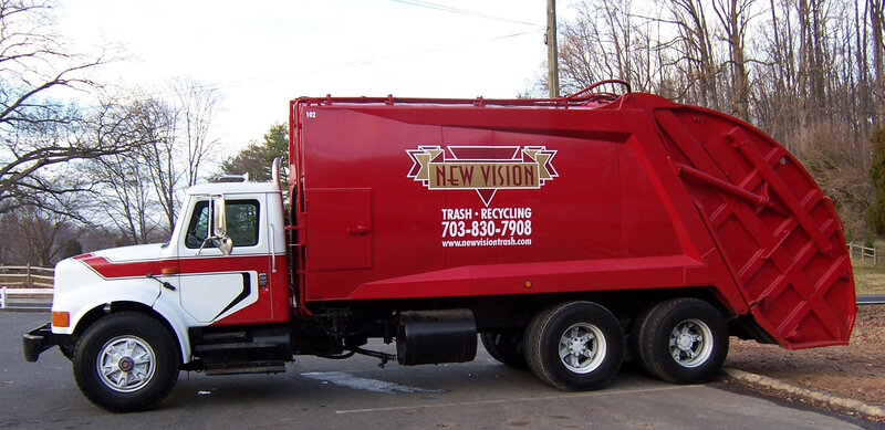 red garbage truck parked