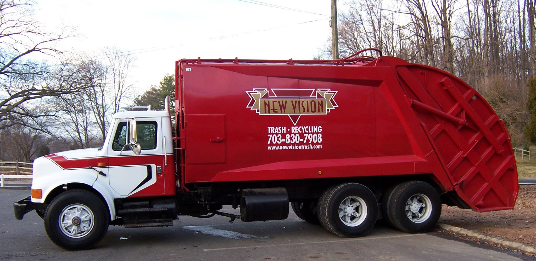 red garbage truck parked