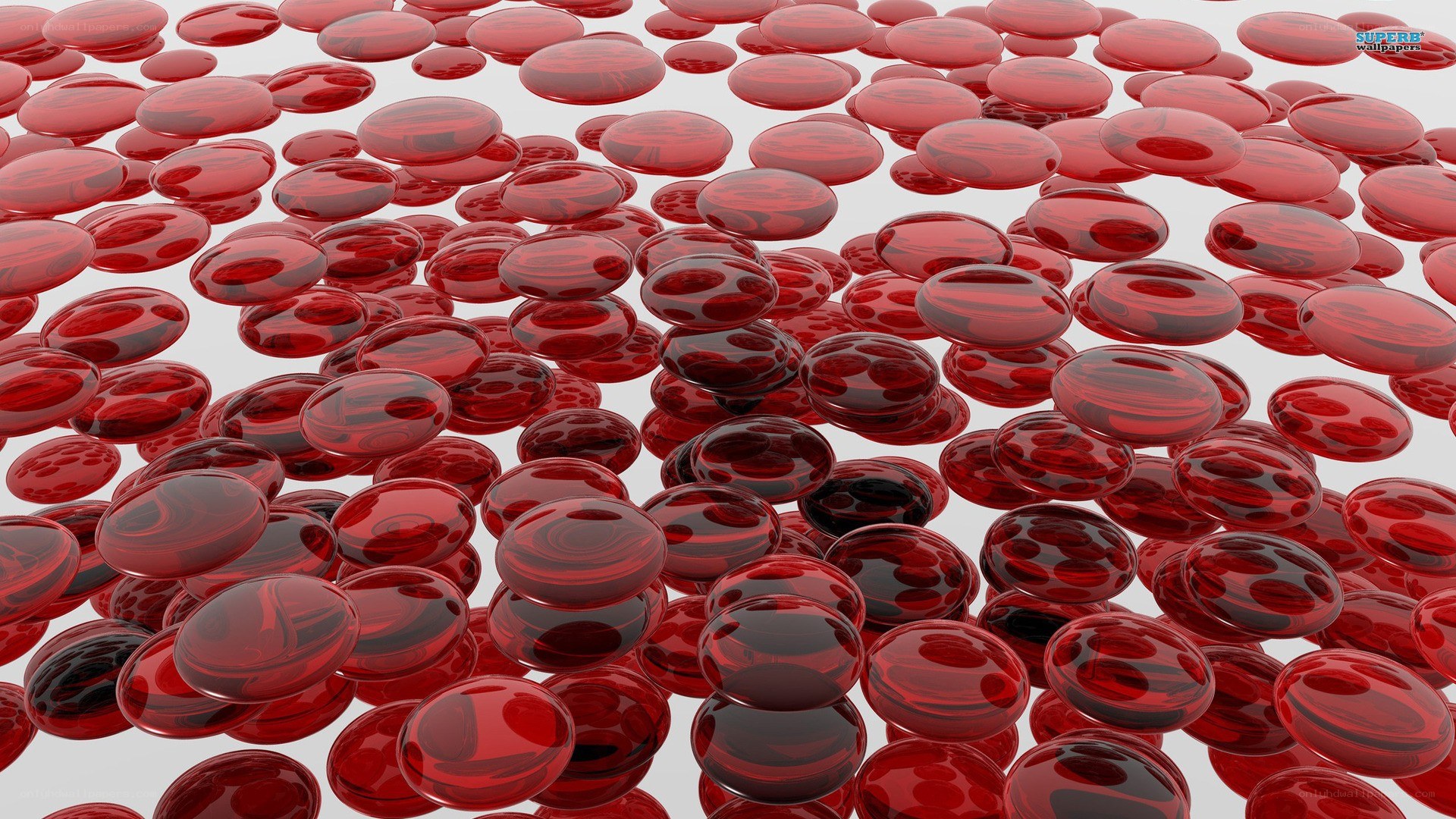Red glass beads on white surface