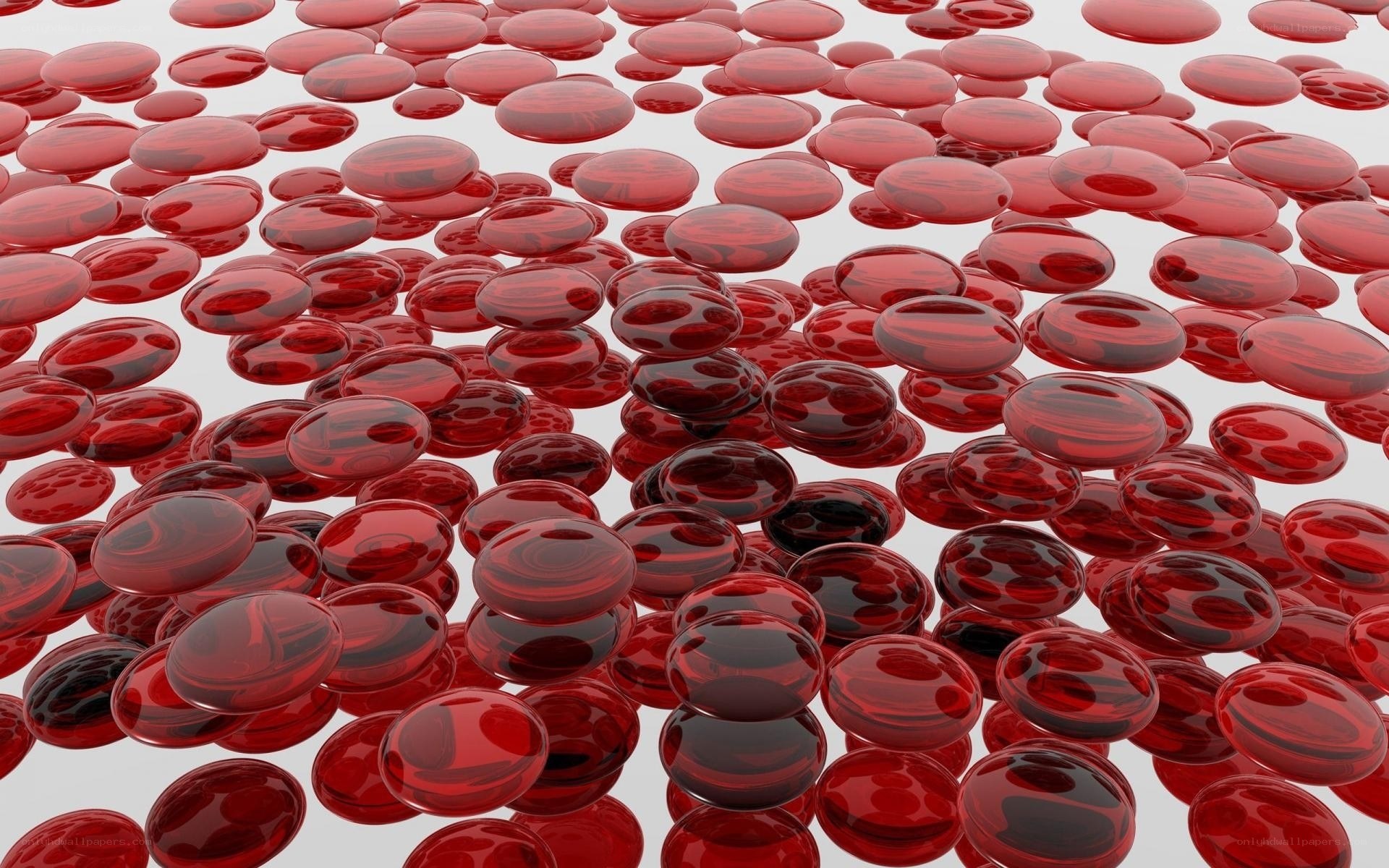 Red glass beads scattered on white