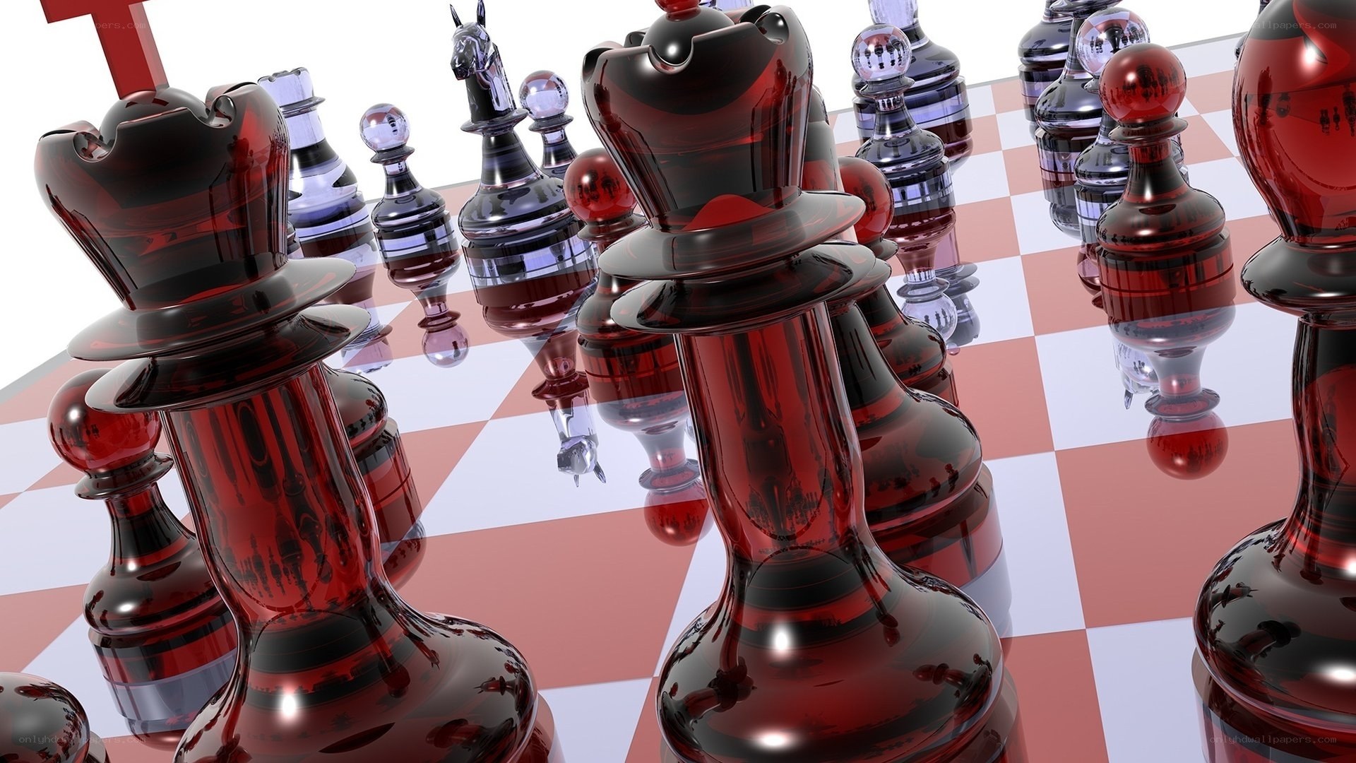 Red glass chess pieces on board