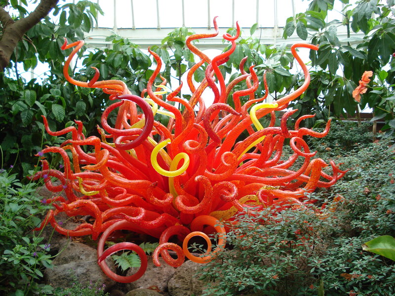 Red glass sculpture in garden