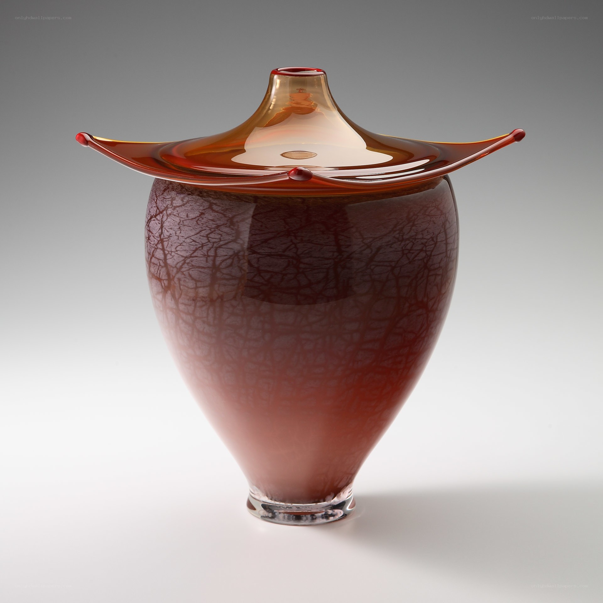 Red glass vase with lid
