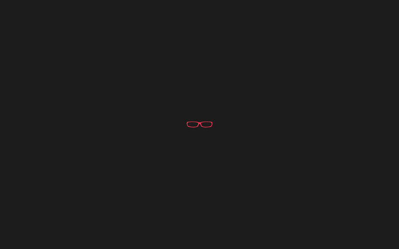 red glasses icon on black