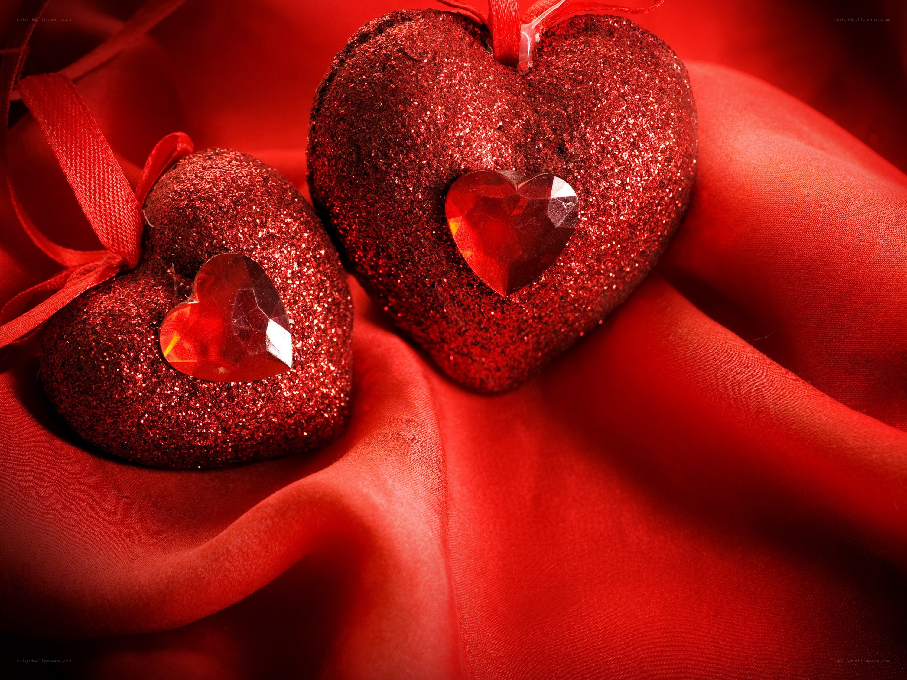 Red glitter hearts on fabric