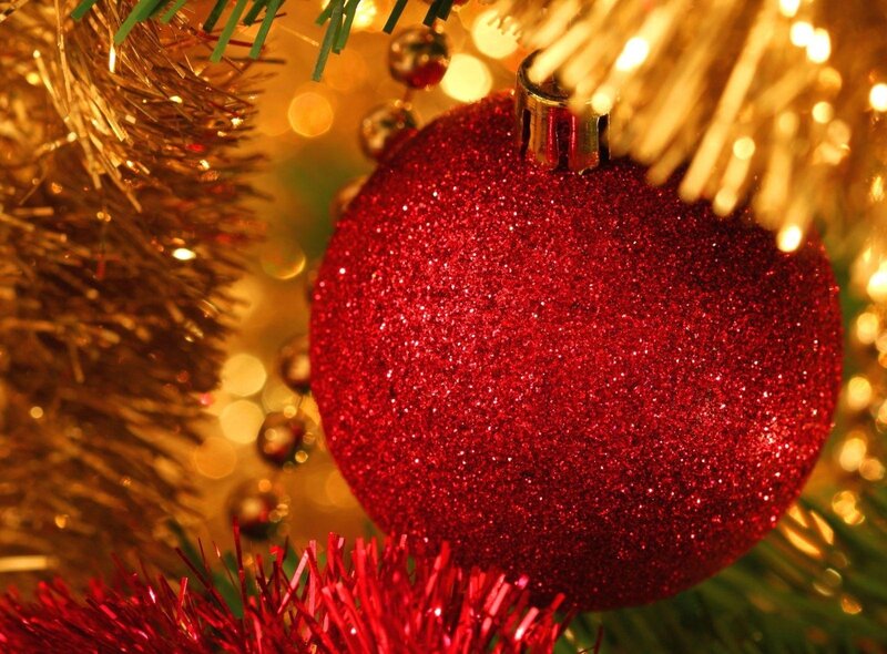 Red glitter ornament on tree