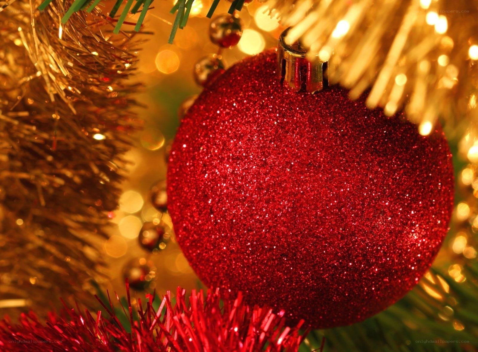 Red glitter ornament on tree