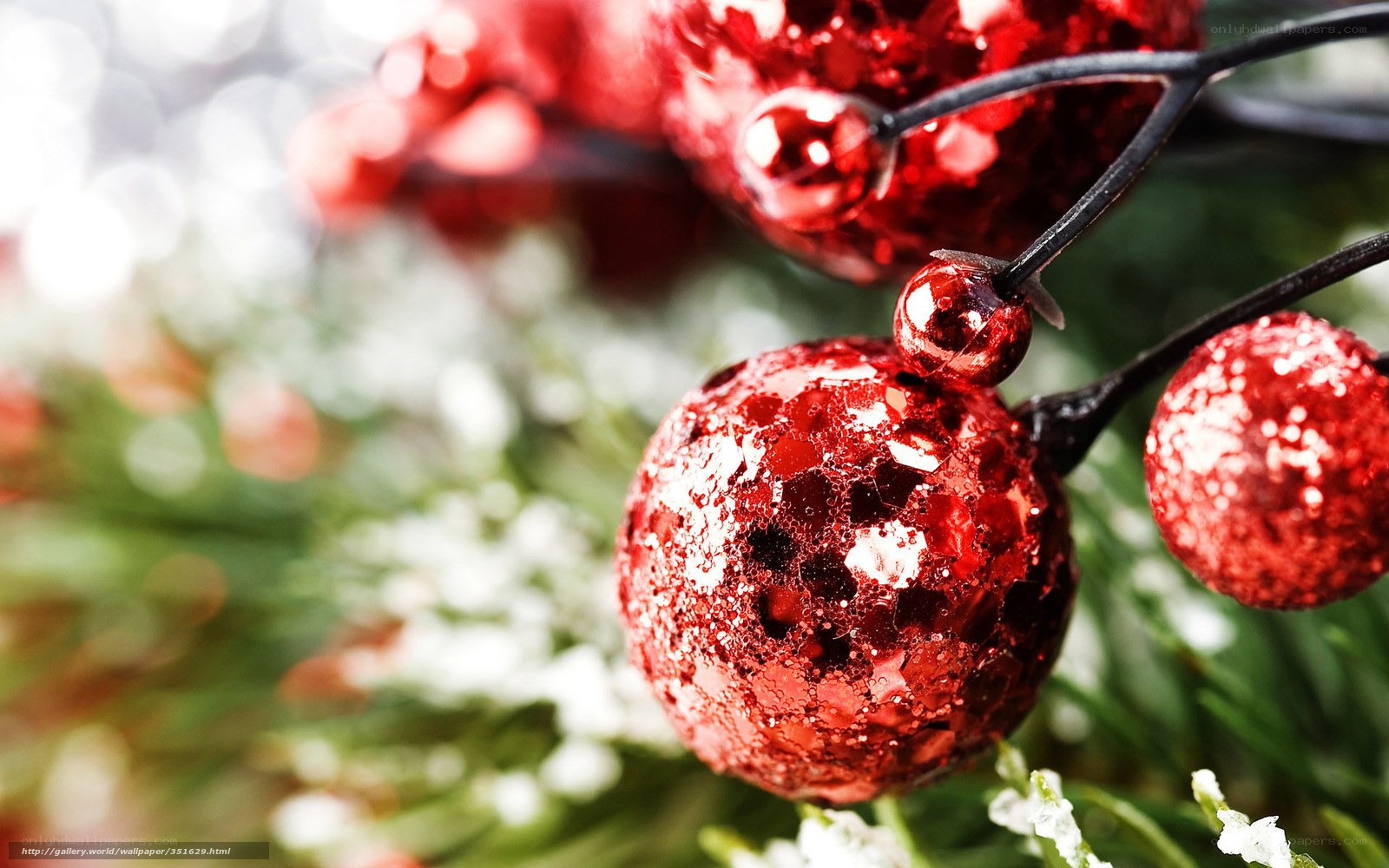 Red glitter ornaments on branch