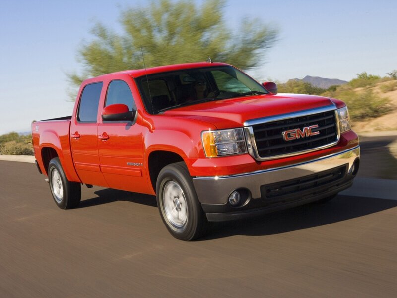 Red GMC Sierra in motion