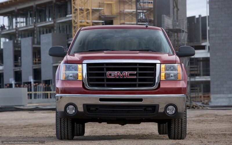 Red GMC truck at construction site
