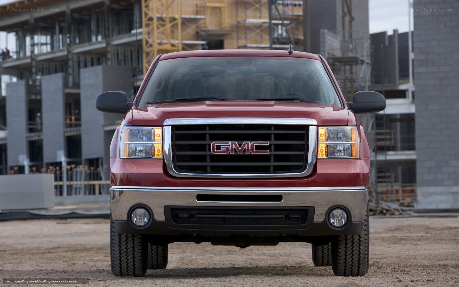 Red GMC truck at construction site