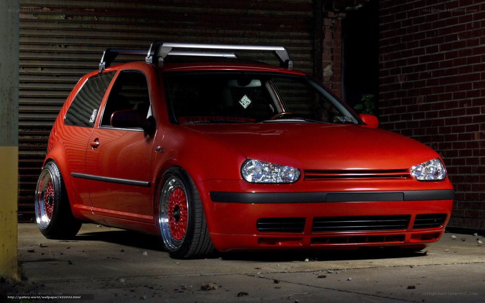 Red Golf GTI with custom wheels