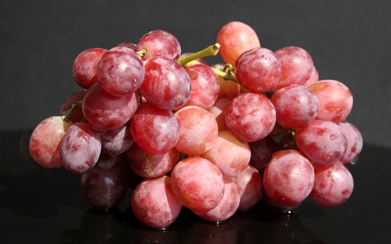 Red Grapes on Black Surface
