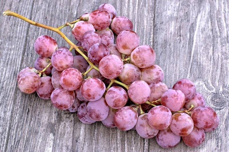 Red Grapes on Wood