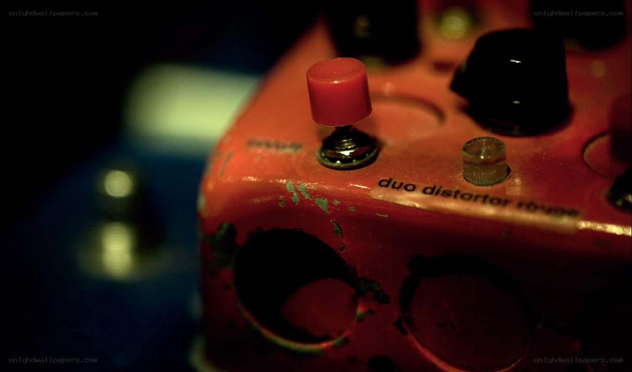 red guitar pedal close-up