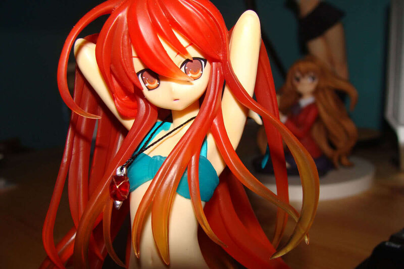 red-haired anime figure in bikini