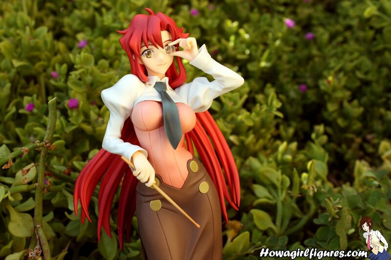 red-haired anime figure in garden