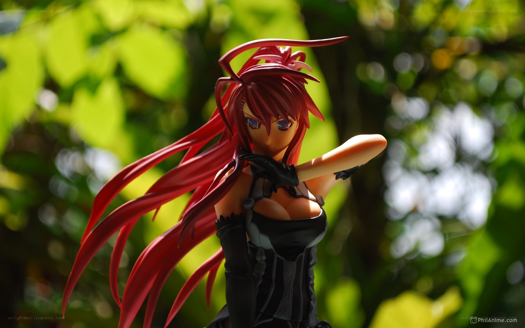 red-haired anime figurine outdoors