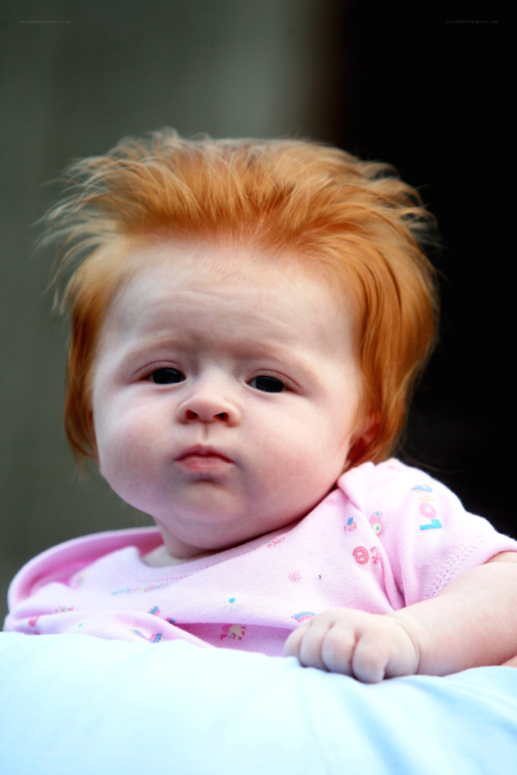 red-haired baby in pink