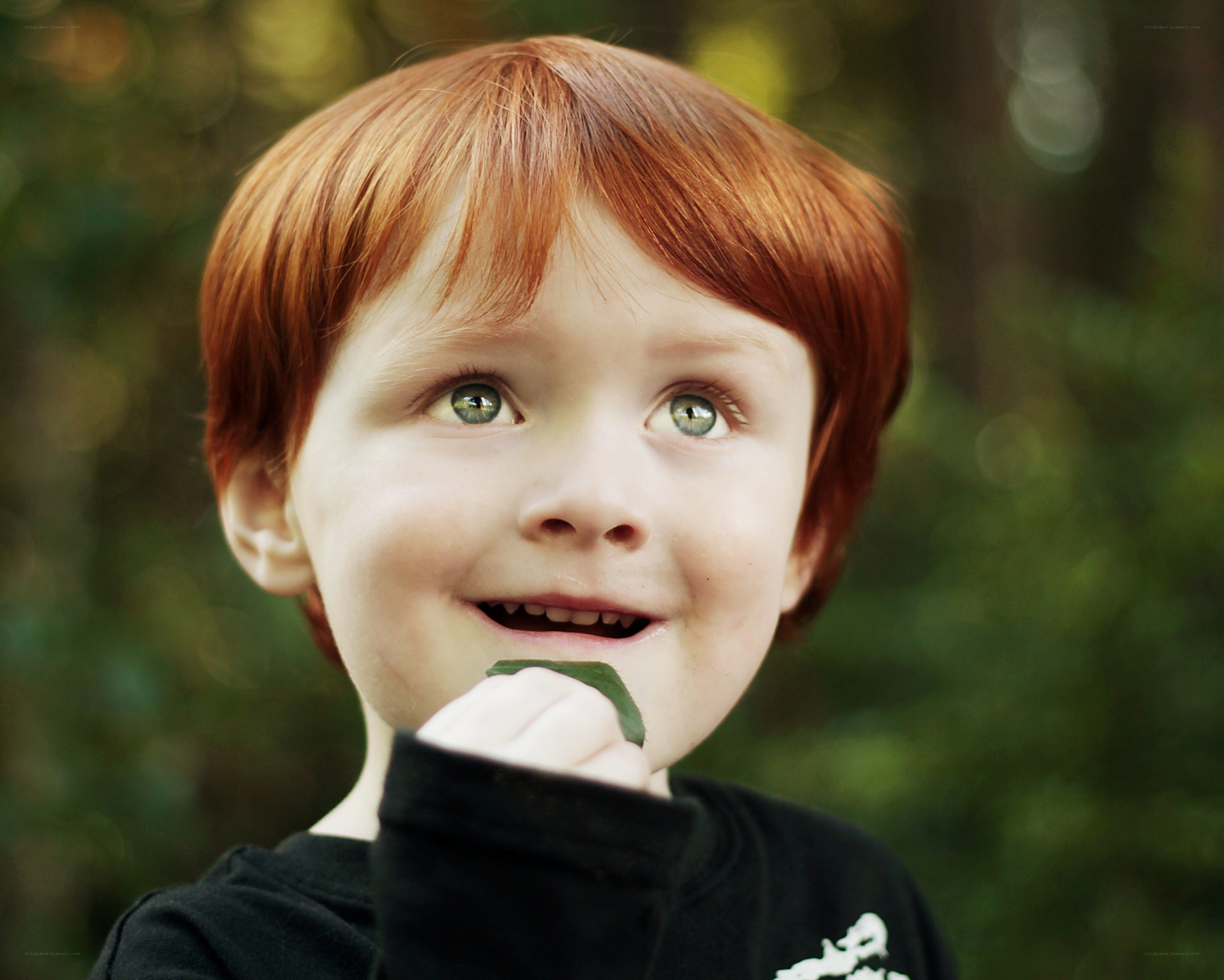 red-haired boy with leaf