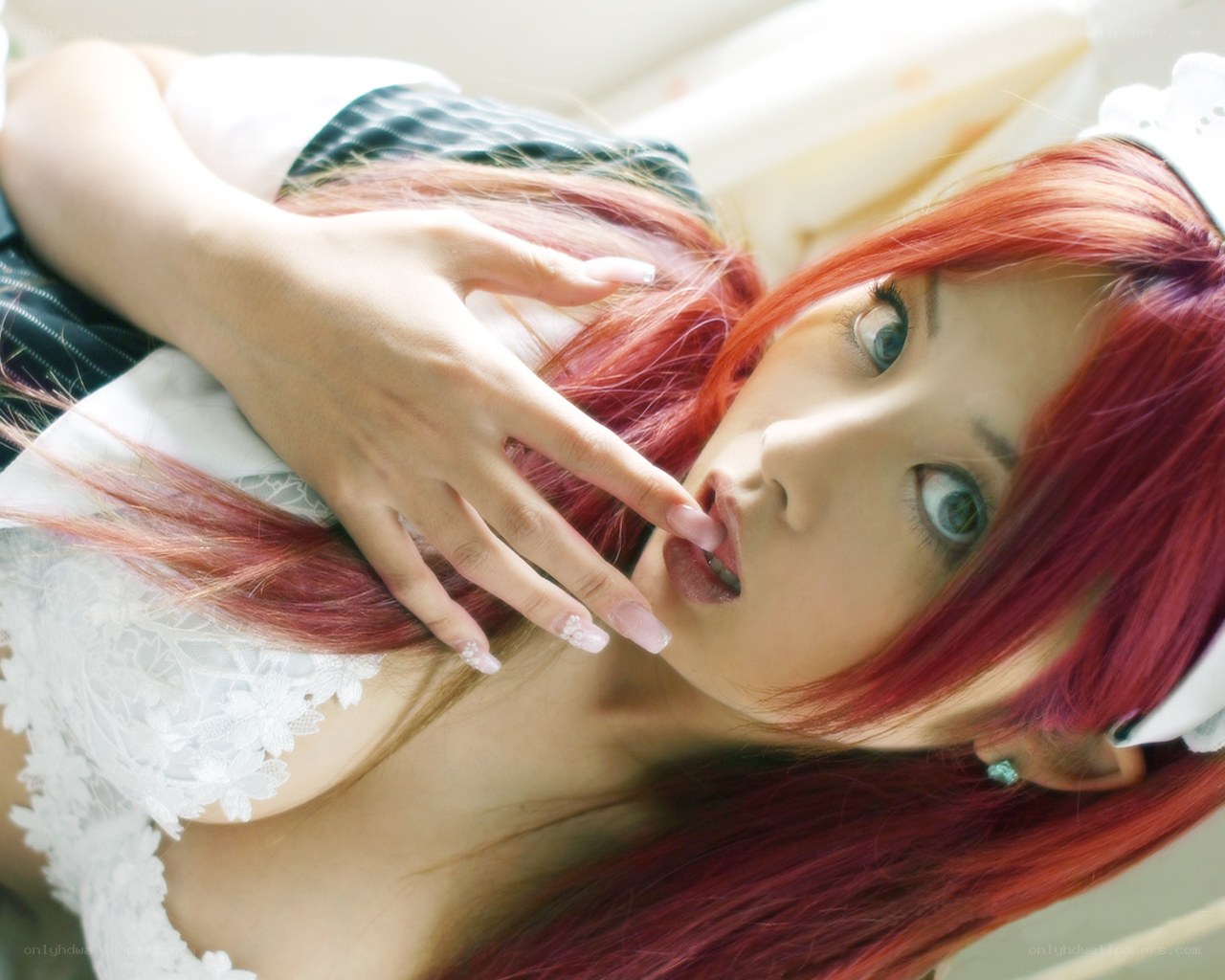 red-haired cosplayer in maid outfit