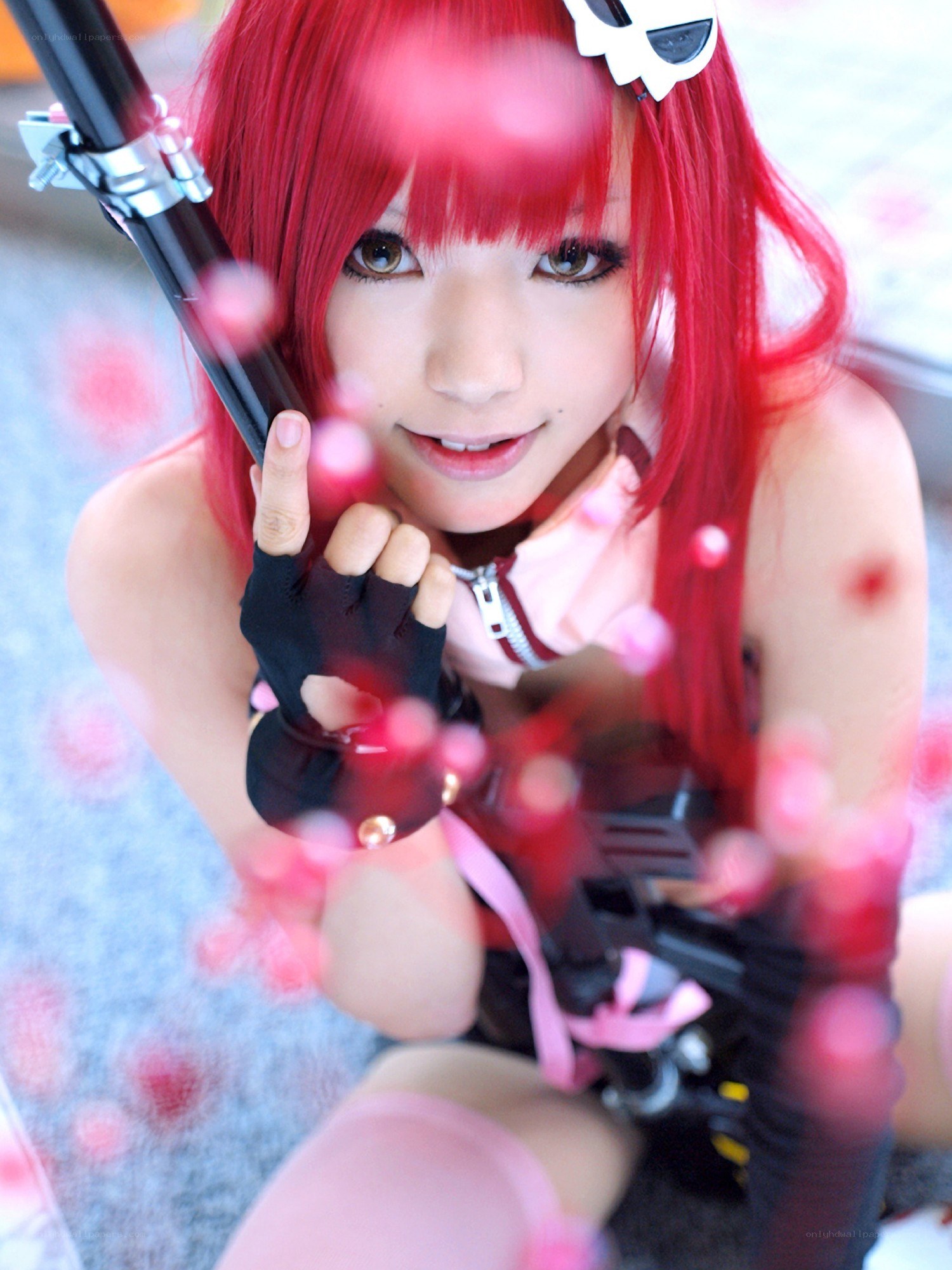 red-haired cosplayer with weapon
