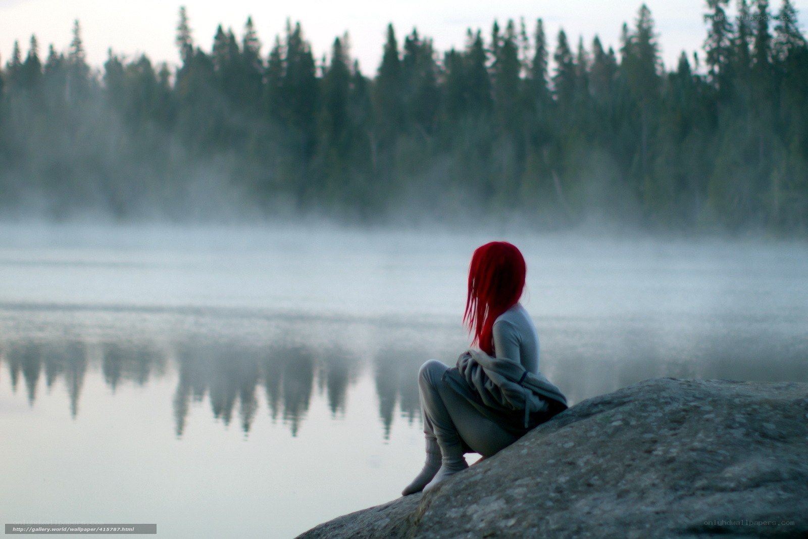 Red-haired figure by a misty lake