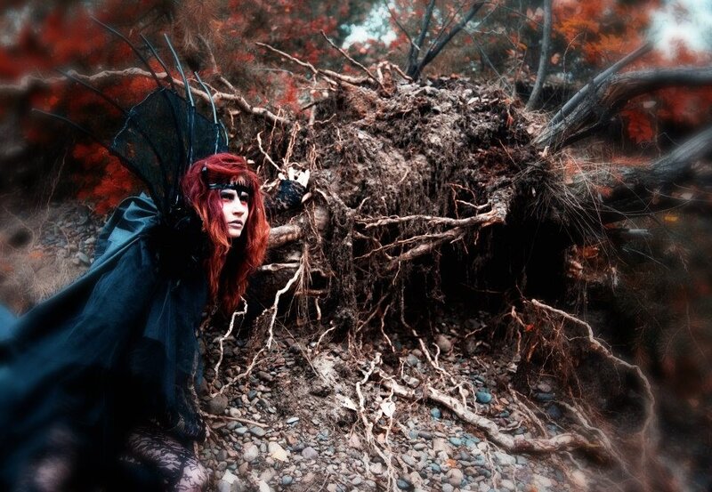 Red-haired figure with wings