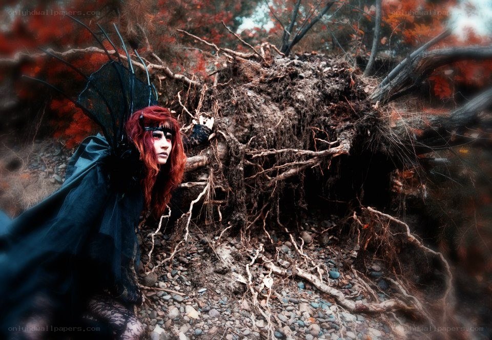 Red-haired figure with wings