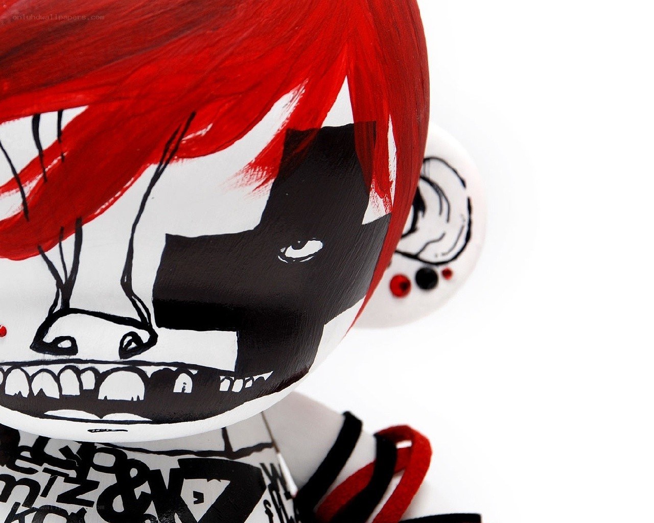 red-haired figurine with skull design