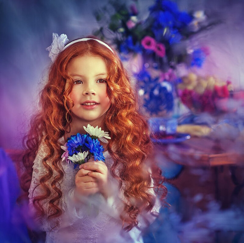 Red-haired Girl Holding Flowers