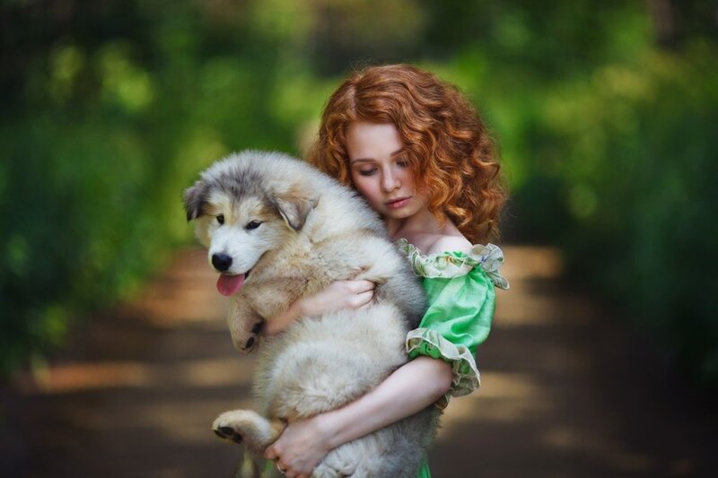 Red-haired Girl Holding Puppy