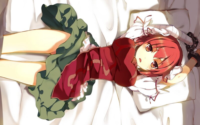 Red-haired girl in bed