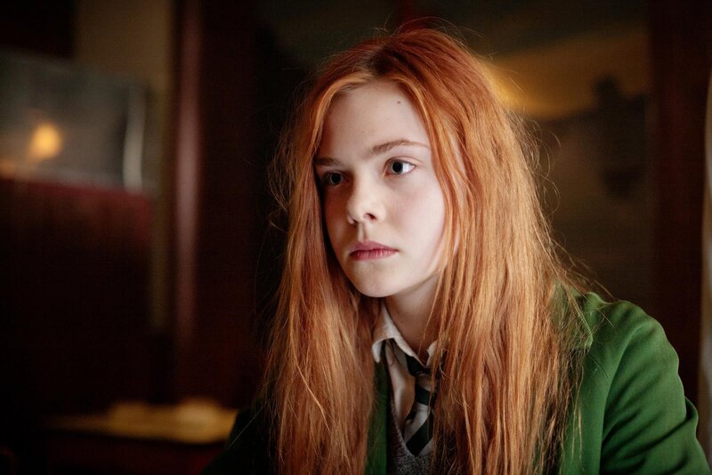 red-haired girl in green jacket