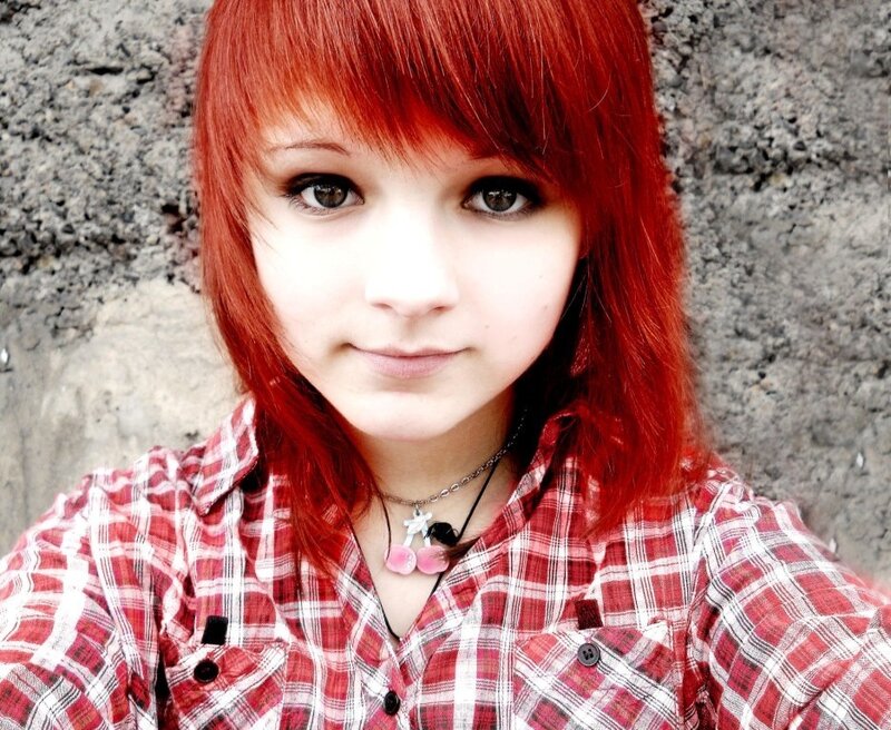 red-haired girl in plaid shirt