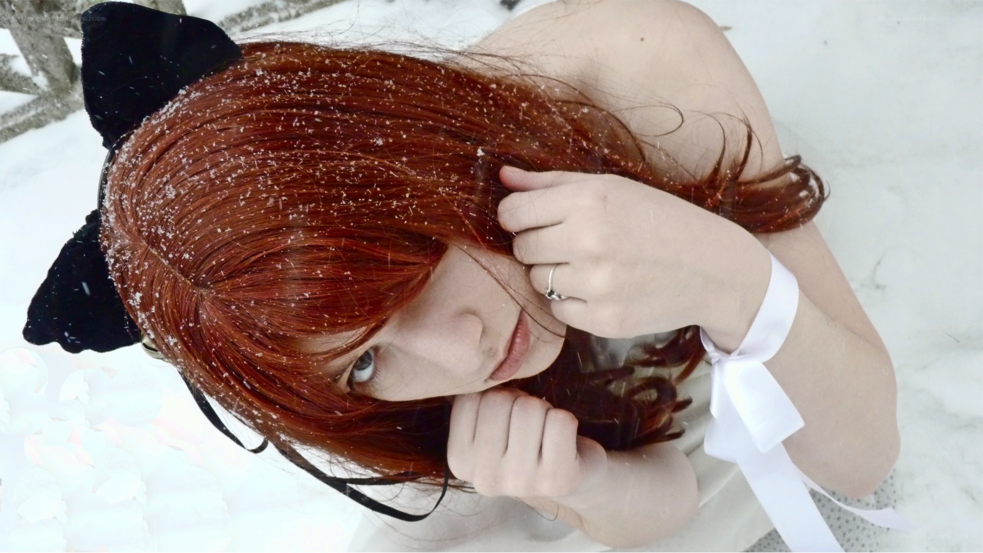 Red-haired girl in snow