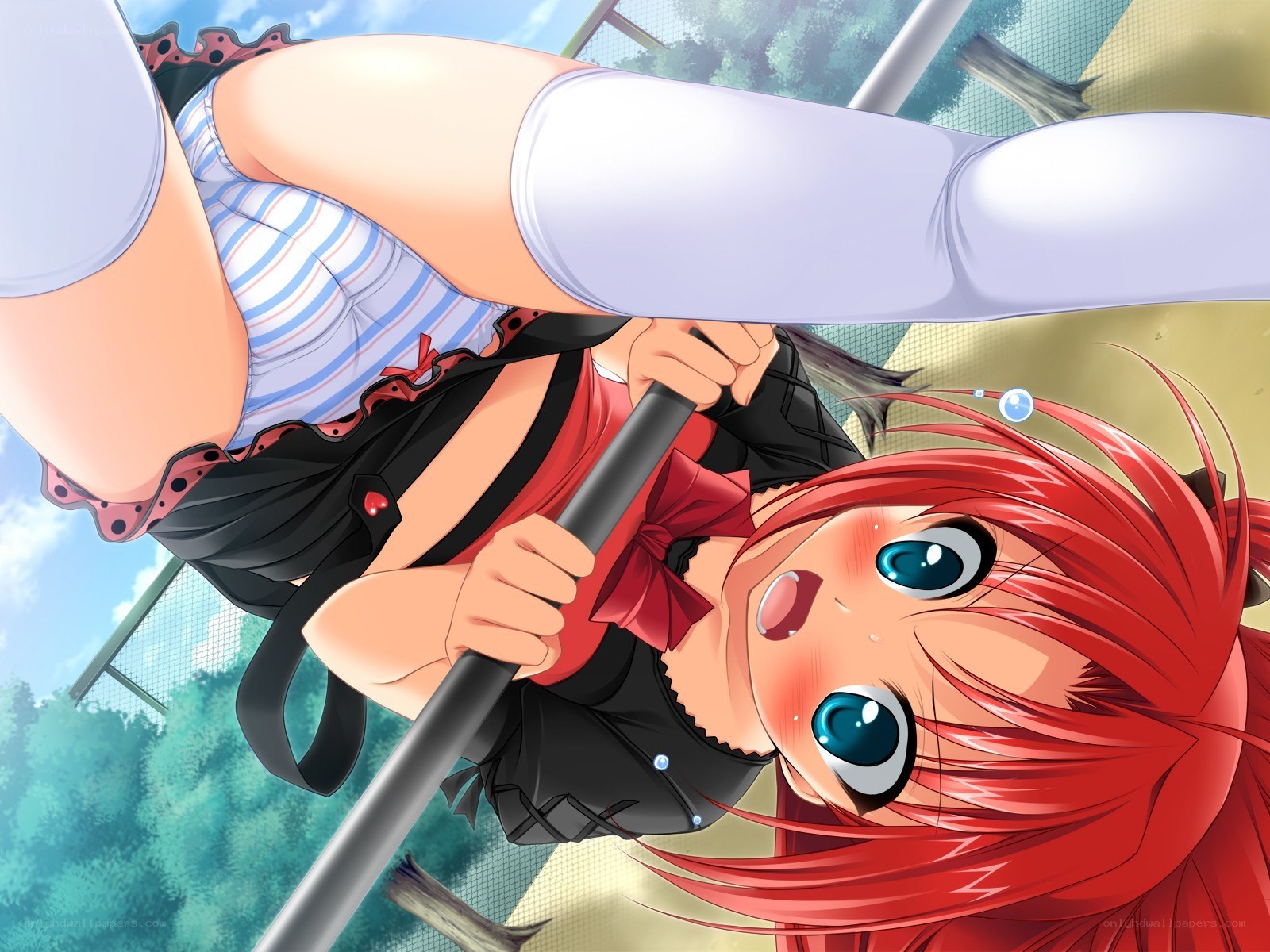 Red-haired girl on a pole
