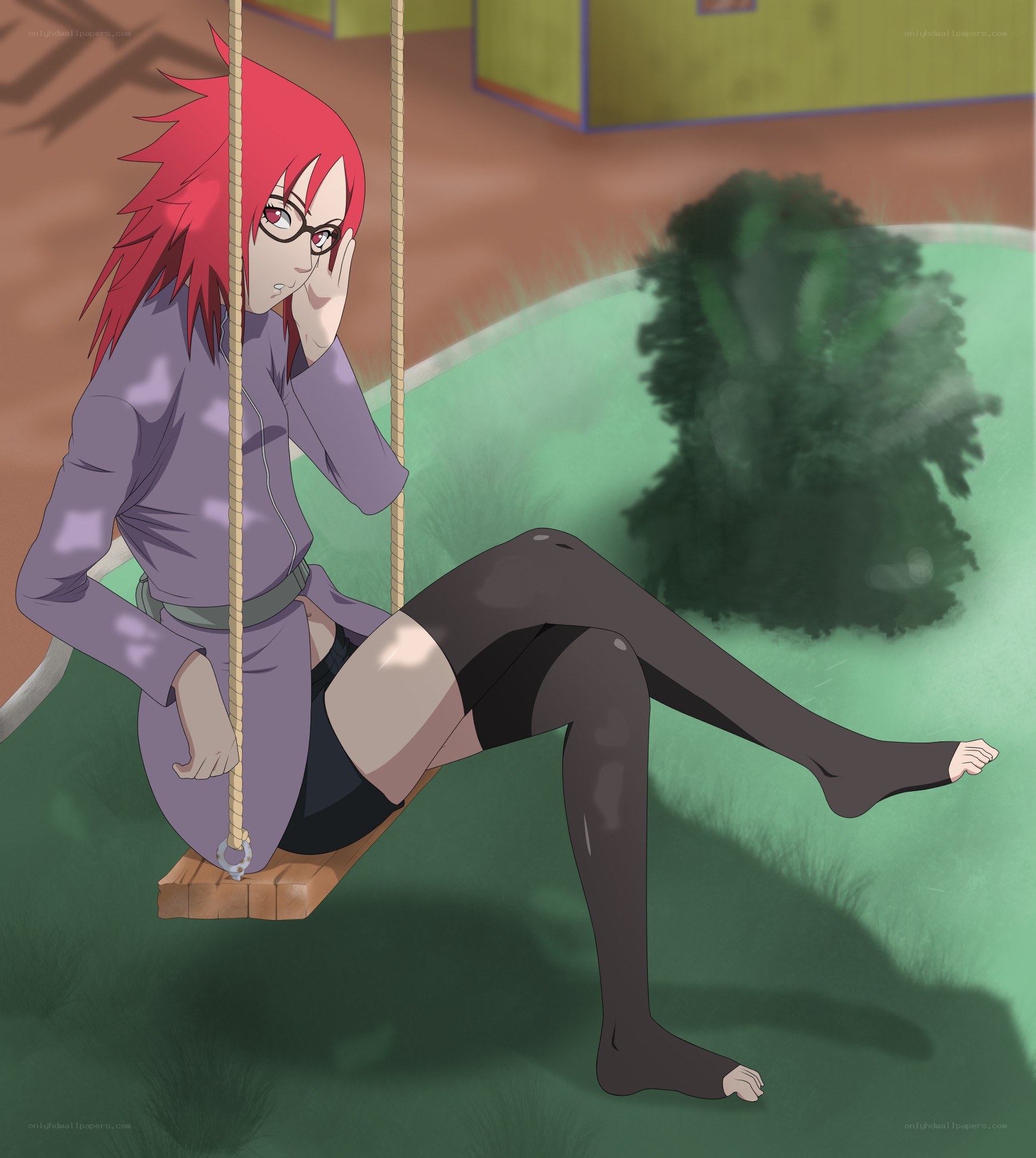 Red-haired girl on a swing