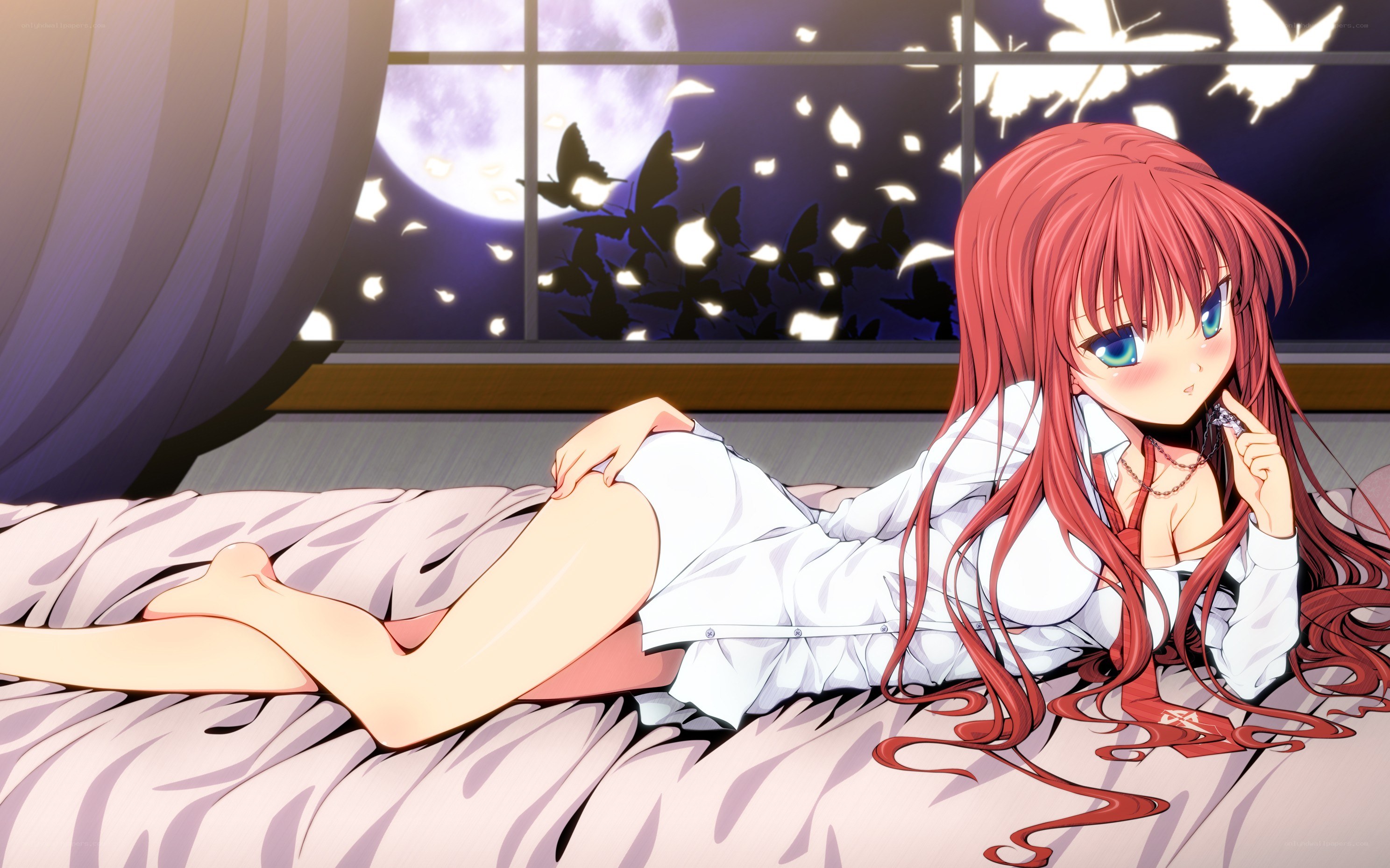 Red-haired girl on bed at night