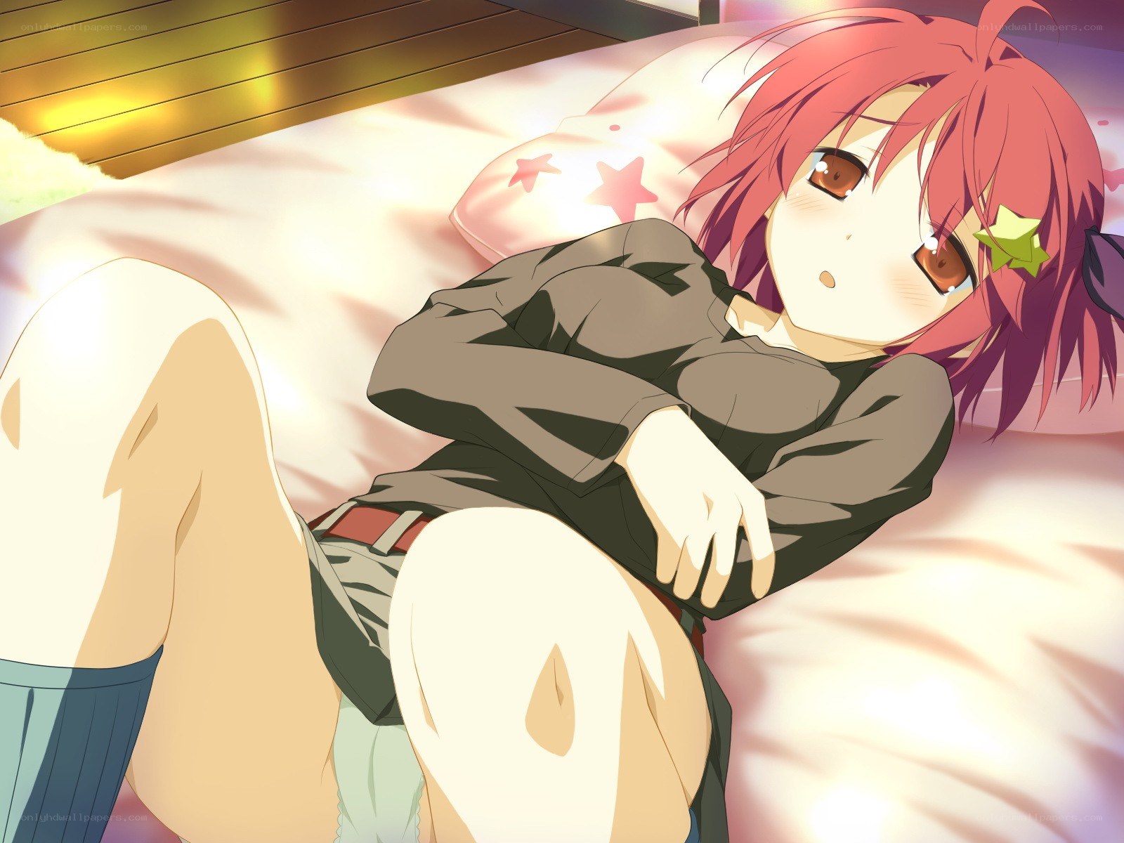 Red-haired girl on bed