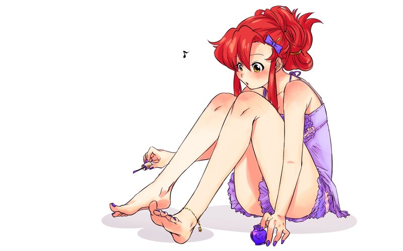 red-haired girl painting toenails