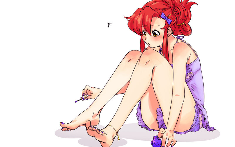 red-haired girl painting toenails