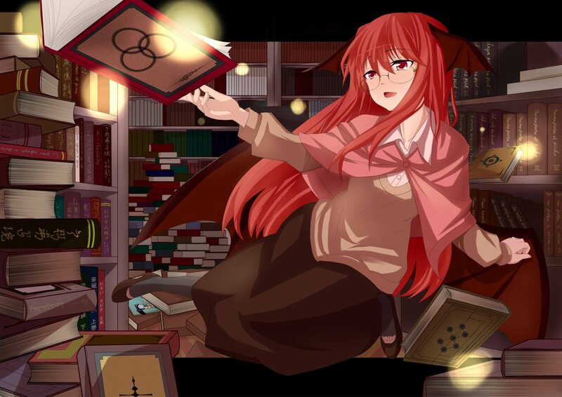 Red-haired girl reading in library