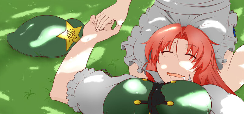 Red-haired girl resting on grass