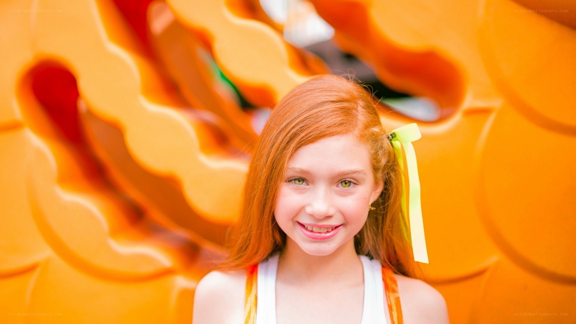 red-haired girl smiling at camera