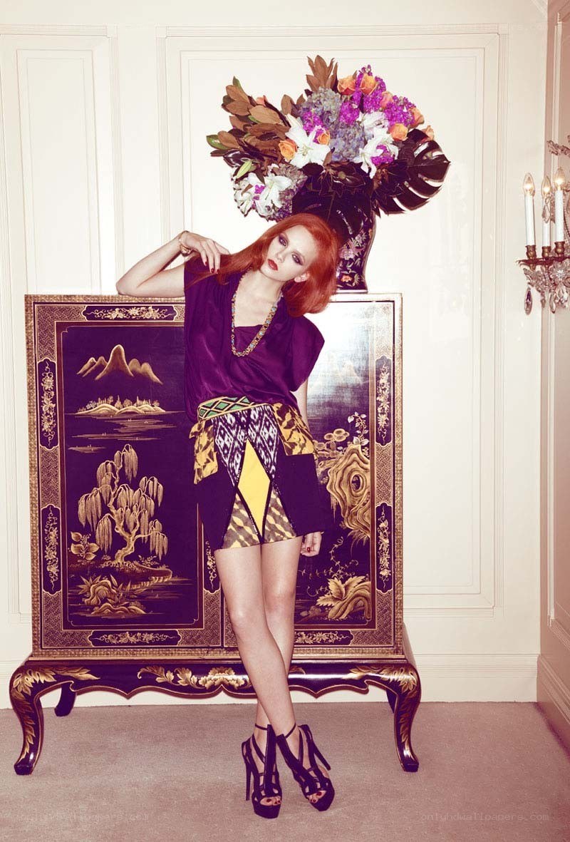 Red-haired model with floral headdress